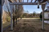 This arbor is accessed by French doors at the primary bedroom.