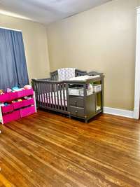 3rd Bedroom with closet and window featuring Hardwood Floors