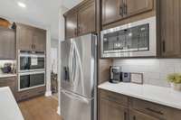 Baking and cooking for the family or guests is easy with the layout of this chef's kitchen and the double electric ovens.