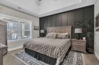 Primary bedroom with deep tray ceilings gives a luxury feel.
