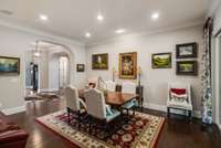 Dining area off living room with sliding door to covered back porch