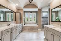 Tons of storage in this luxurious master bathroom with separate soaking tub and shower