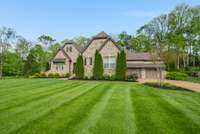 This meticulously maintained yard is irrigated by a private well on the property that is separate from the Utility District water system.