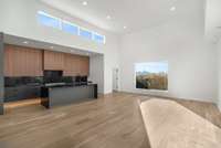 Living room space fills the rest of the room with views out both directions!