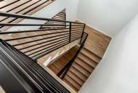 Stairs or elevator down to the Primary Suite FLOOR - the entire floor is the primary suite and a private office.