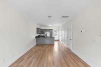 Main level has great storage under the stairs as well as a half bath and laundry closet with storage space