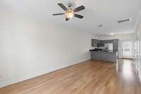 Sand and stain hardwood flooring throughout the main level