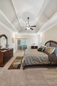 Primary Bedroom with Direct Access To Enclosed Porch & Hot Tub !!
