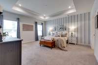 The very spacious owner's suite is on the main level and has its own access to the screened in porch.