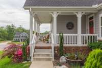 The extra-large front porch welcomes you!!