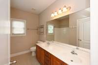 FULL BATH WITH DOUBLE SINKS & LINEN CLOSET BEHIND ENTRY DOOR