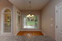 EAT-IN KITCHEN HAS DOOR LEADING TO SCREENED IN DECK AREA