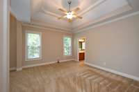 PRIMARY BEDROOM HAS TREY CEILING