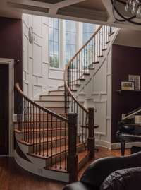 Grand staircase. Each stair is backlit, along with side lights, candelabras, a feature chandelier, and dome backlighting