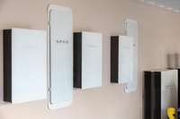 2 EV charging stations and 6 wall battery packs serving the 82 solar panels