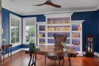 Bedroom 2 with built-in backlit bookshelves
