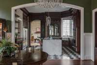 Archways beckon you through to the kitchen