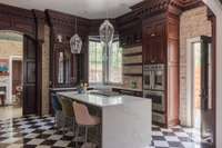 Stunning, custom, cherry cabinets.  Waterfall Island.  22 series outlets.  French Oven and secondary oven.  Backlit shelves and glassware cabinet.