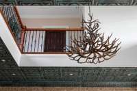 Statement chandelier and tin-tile ceilings