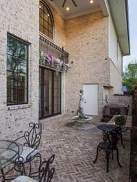 New Orleans inspired courtyard complete with fountain and a two-person hot tub.