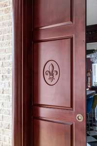 Custom arched pocket doors separate the den from the kitchen