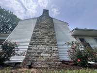 Original stack stone 2 story fireplace