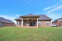 Covered porch on back....great for entertaining....go to back of yard and have bonfires in the dry creek bed!!