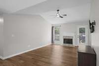 Upstairs living area, with gas fireplace and direct backyard access