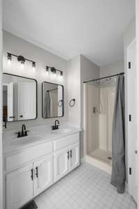 Primary bathroom, with new fixtures, lighting and mirror.