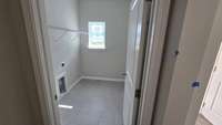 laundry room  - down stairs - buyer to choose tile for limited time