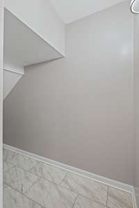 Large storage closet under staircase.