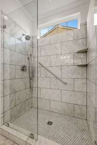 Shower walls and shower floor has Carrara marble tile as well. The marble is from USA Stone in Nashville.