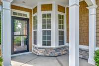 Covered front porch! The front storm door was replaced in January 2023 with a Larson Platinum Retractable Screen door by Booher Construction.
