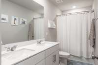 Upstairs full bath with double vanities