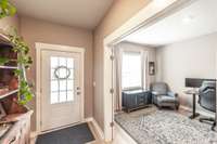 Entryway with an office/flex space with French doors for privacy