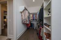 Walk in Primary closet connects Primary Bath and Utility Room