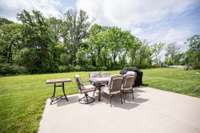Extra concrete off covered patio for outdoor seating/Grill