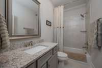 Fourth Full Bath has Tile surround/ Granite countertops is situated between Fourth Bedroom and Bonus
