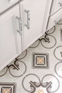 New stylish tile flooring in the primary bathroom.