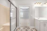 The exquisite primary bathroom features a separate shower & raised double vanity.