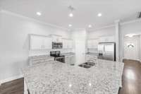 Stunning granite counter-tops! So much workspace for all of your culinary needs.