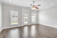 The separate den with LVP flooring and abundant natural light is the perfect reading spot.