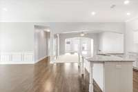 Gleaming LVP flooring & recessed lighting throughout the kitchen and dining areas.