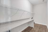 For added convenience, the enormous utility room offers a 7 foot long countertop perfect for laundry tasks.