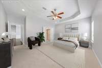 Virtually staged photo of the primary bedroom.