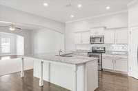 The massive 7' x 6' L-shaped island is perfect for bar seating and entertaining.