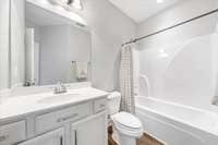 The guest bath includes a convenient single vanity along with a shower and tub combo and convenient to the second bedroom.