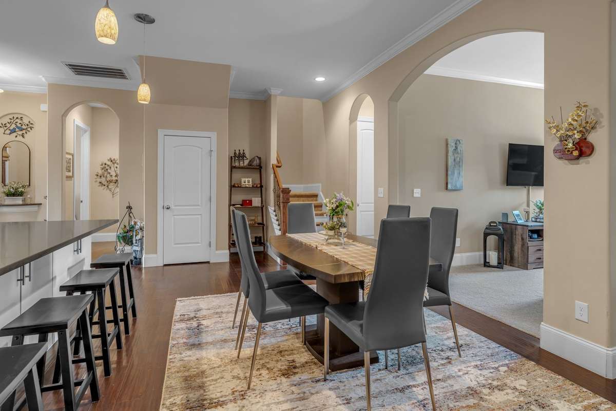 Plenty of Dining Room space, and wonderful Arched Walls throughout home