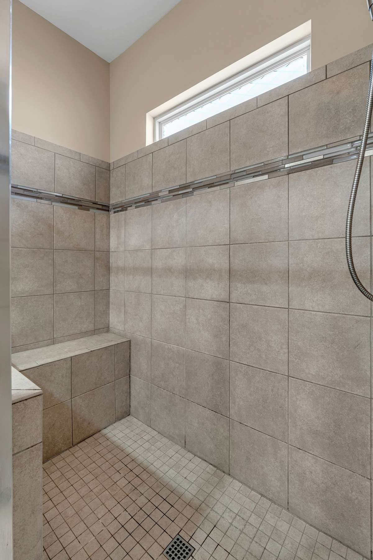 Extra Large Shower with seat, in Master Bath.