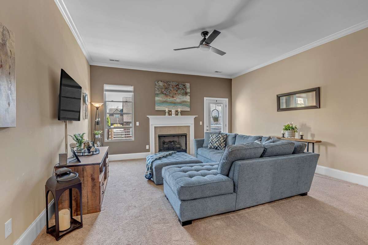 Living Room looking from the Kitchen, Dining area. Beautiful natural light coming in from back window and door. Gas Fireplace also.